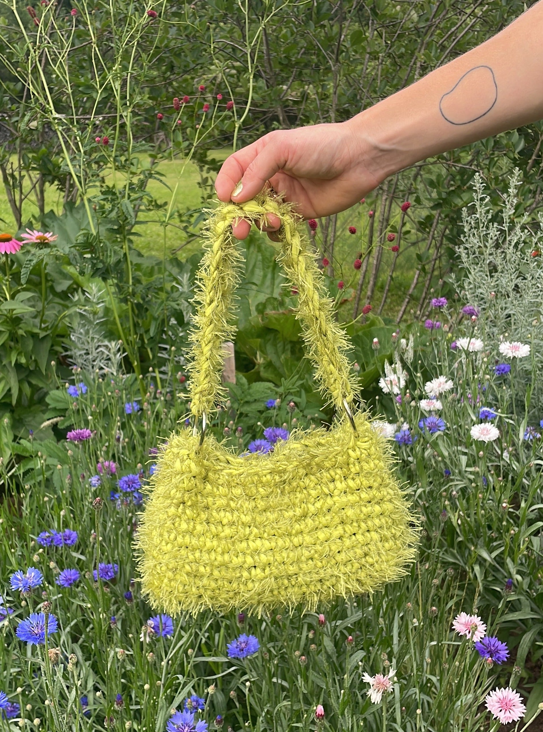 green fluffy crochet bag