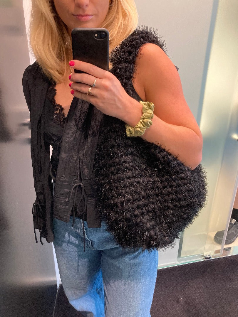 black fluffy crochet bag in size L, made from recycled yarn