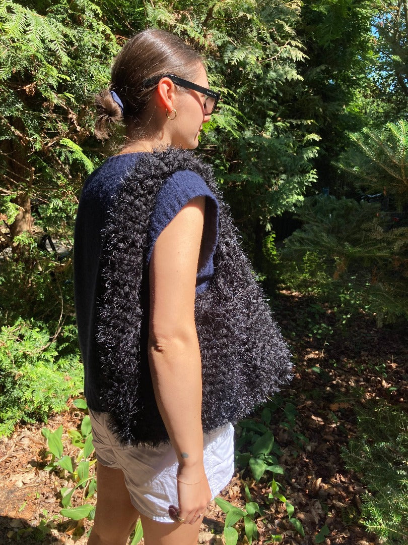 black fluffy crochet bag in size L, made from recycled yarn