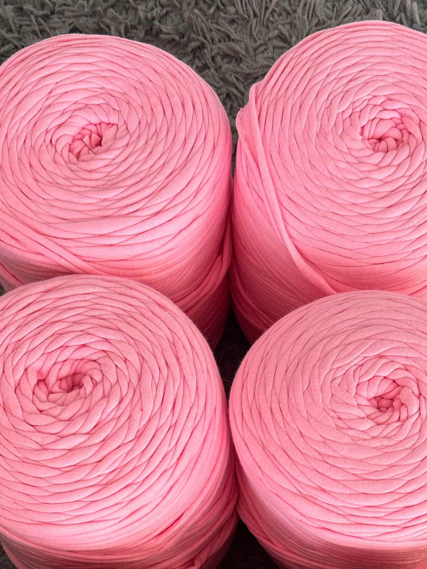 baby pink tshirt yarn on a white background