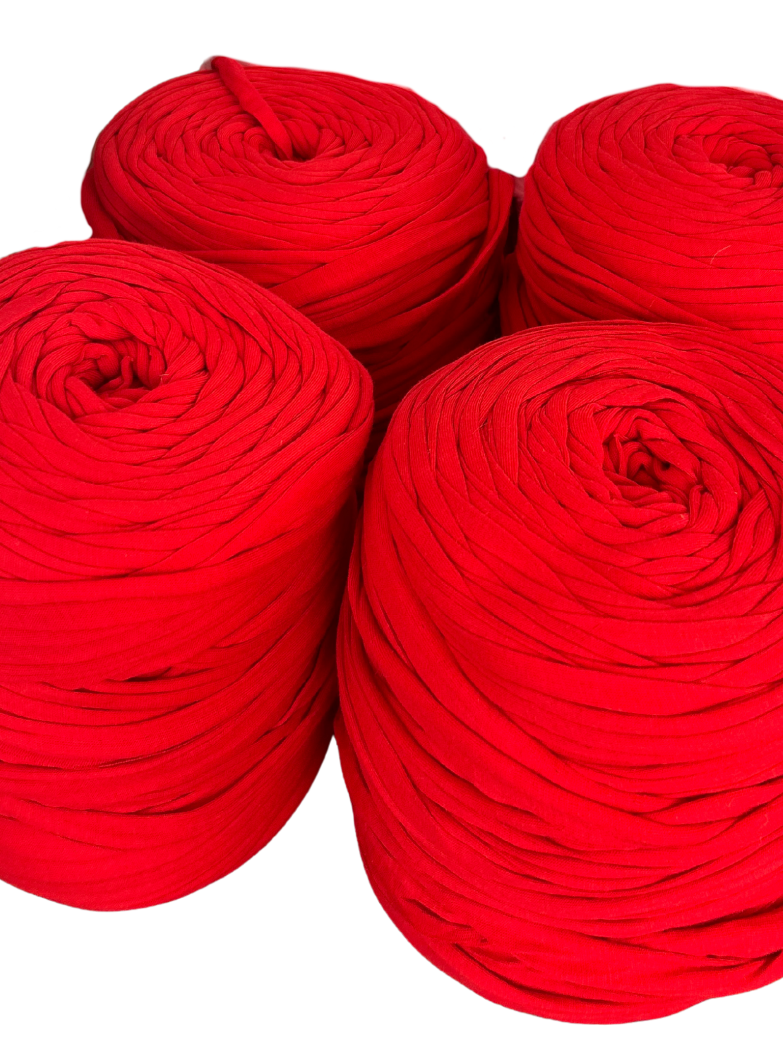 rolls of red tshirt yarn on a white background