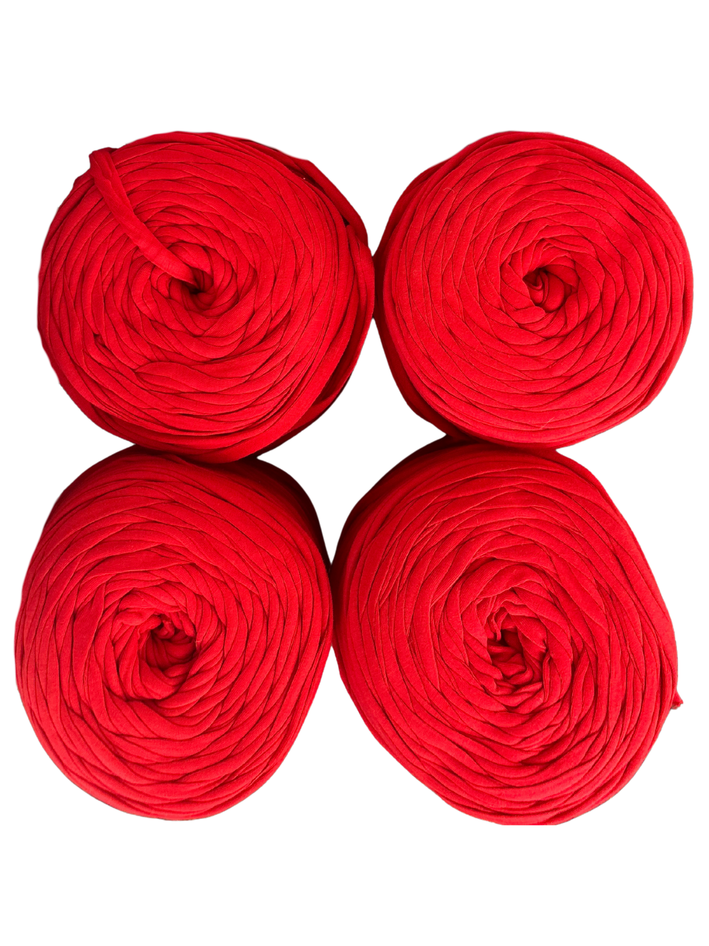 rolls of red tshirt yarn on a white background