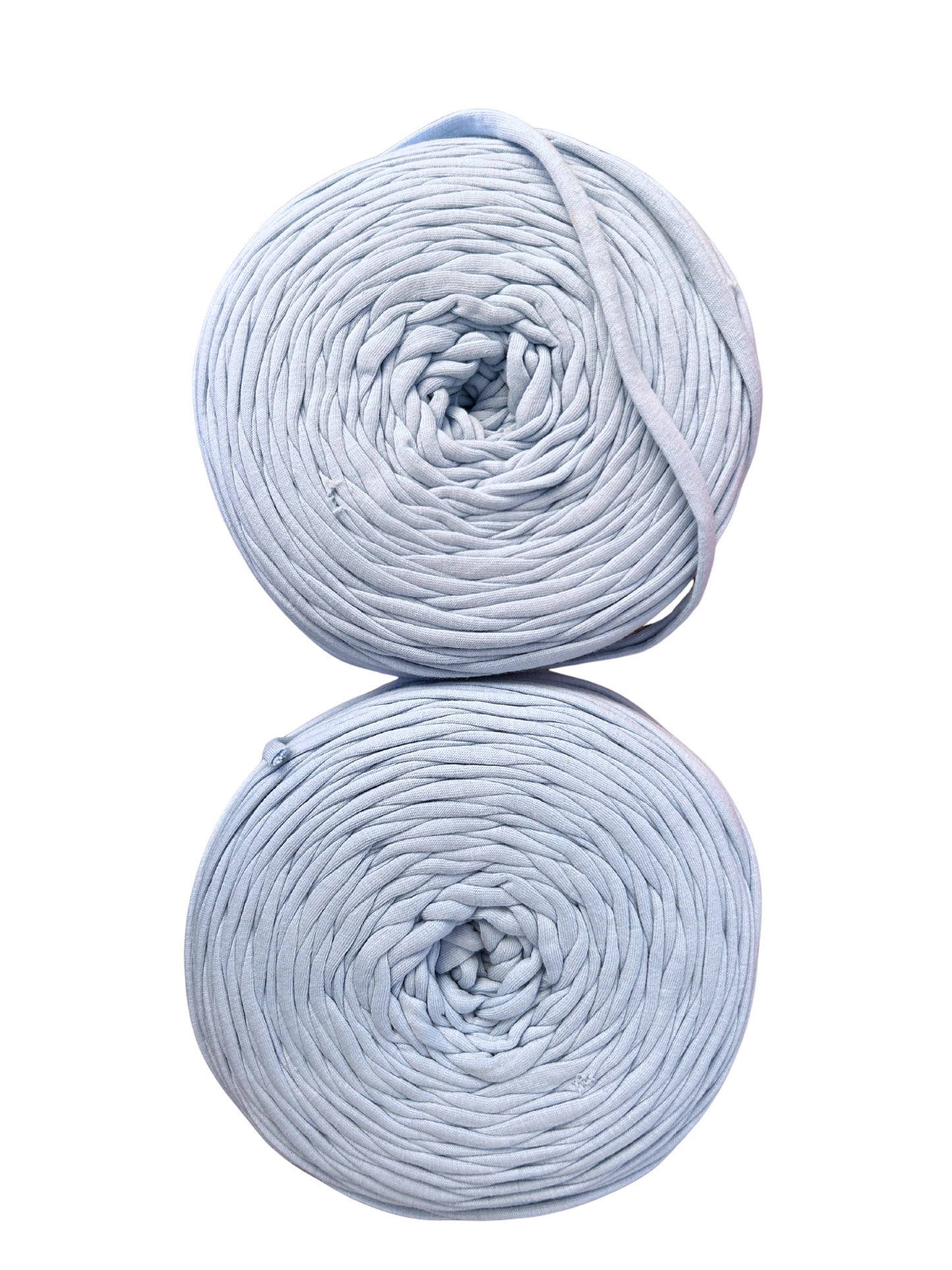 rolls of baby blue tshirt yarn on a white background from the top