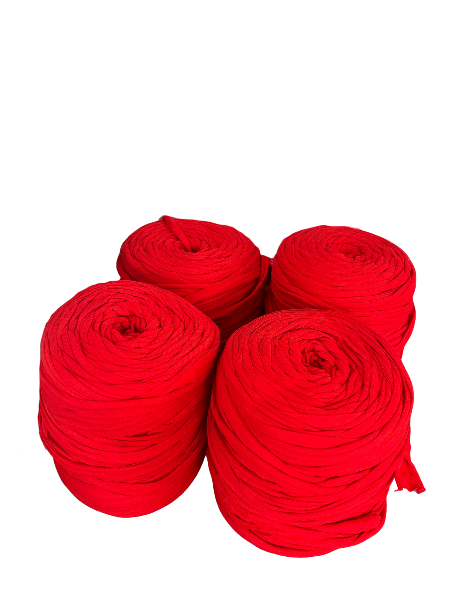 rolls of red tshirt yarn on a white background