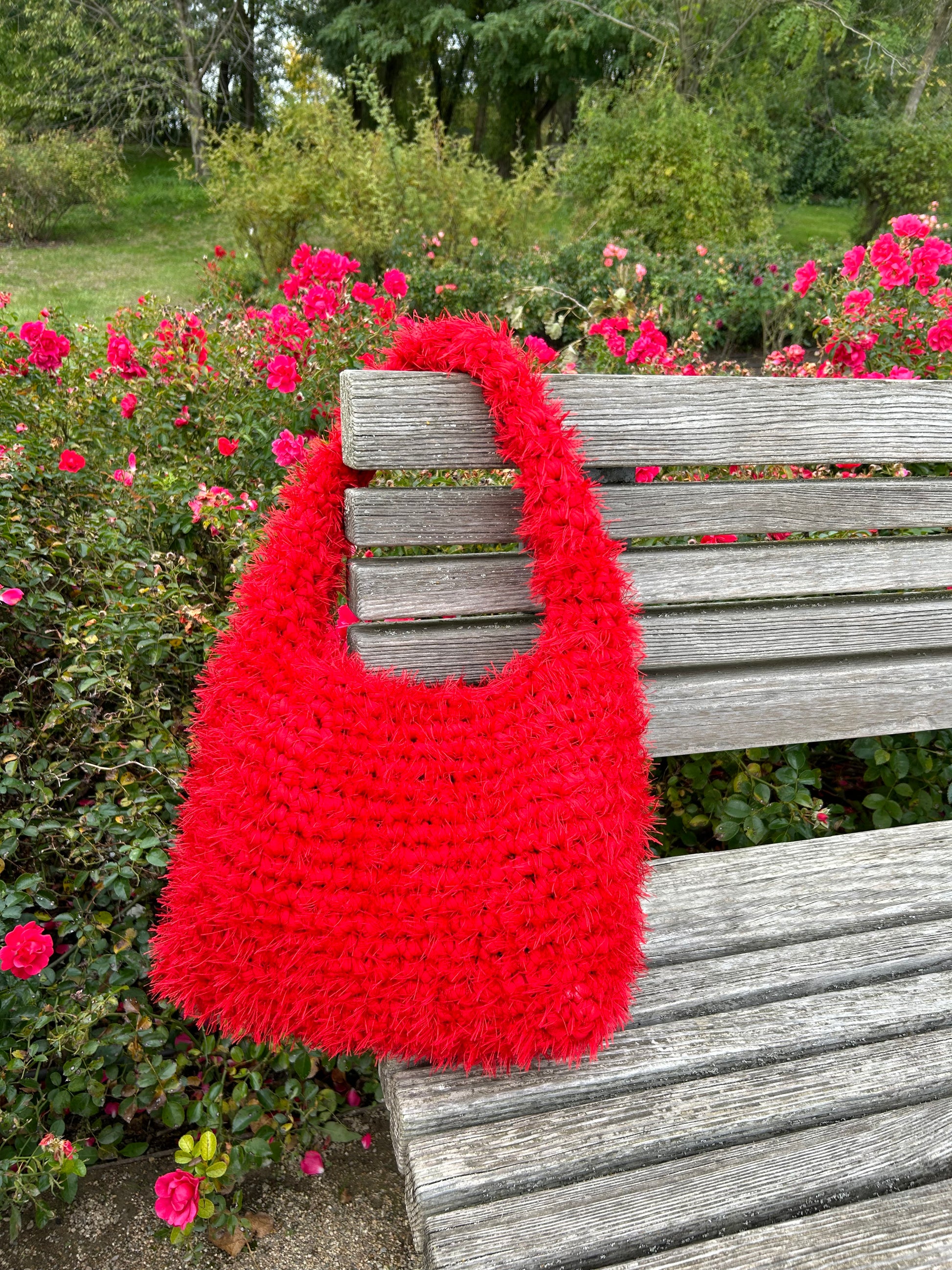 product image of a large red crochet tote bag, a fluffy red crochet bag