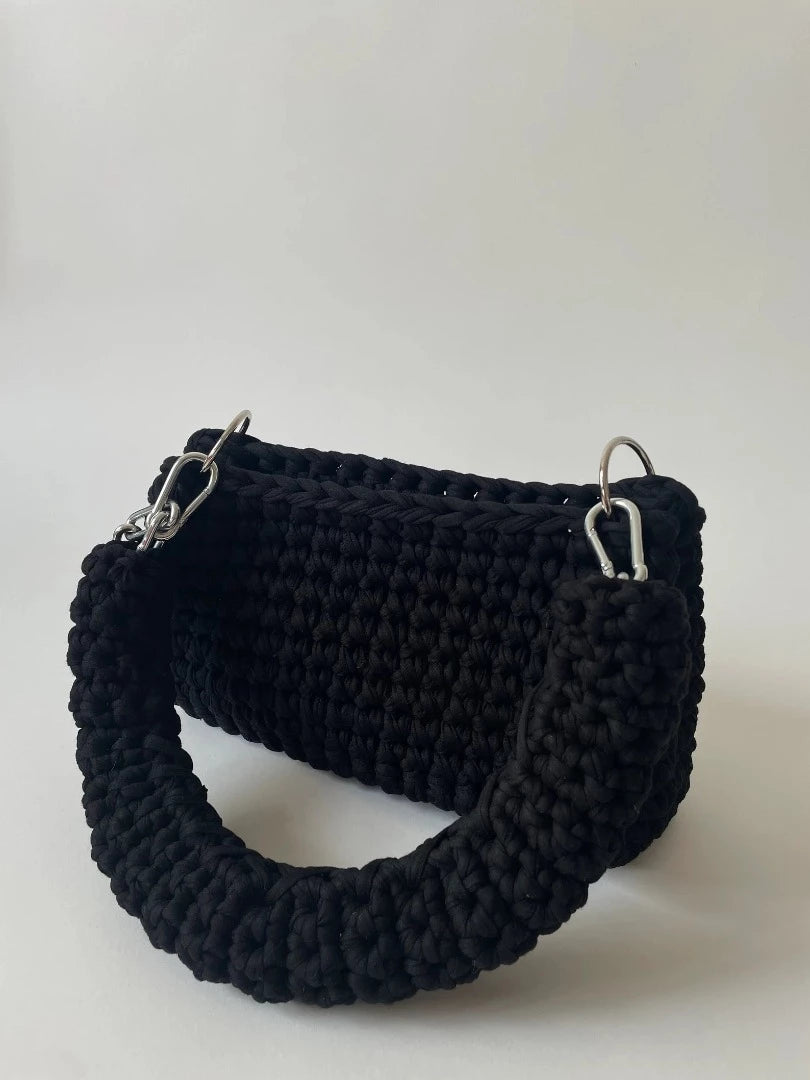 black crochet bag in size L, with an adjustable silver handle