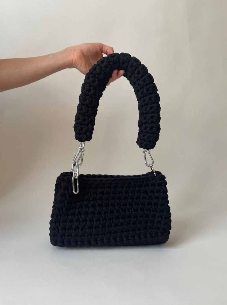 black crochet bag in size L, with an adjustable silver handle
